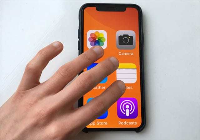 tapping with fingers on iPhone to fix iPhone stuck in Zoom mode